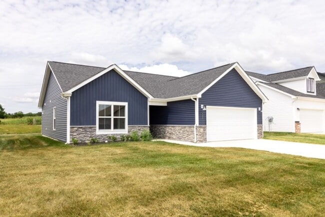 Photo - Modern Living Redefined with Stone Fireplace, Gray Cabinetry, Spa Inspired Primary Suite and Cove...