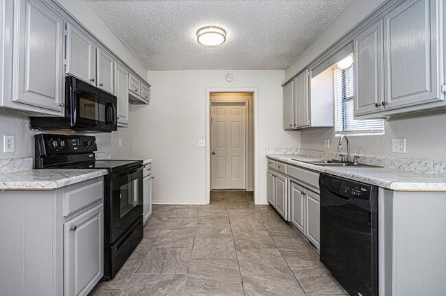 Photo - Corner-Lot 3Bedroom Charmer in Yukon with Fireplace & Enclosed Patio!