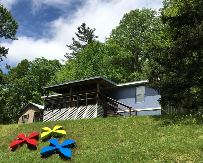 exterior with sculptures - 1496 Winklers Creek Rd House