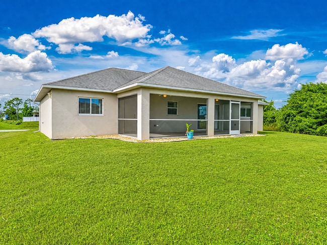 Photo - Spacious Three-Bedroom Home with Open Floor Plan, Large Yard & Screened Patio