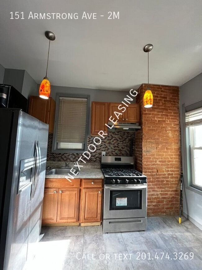Building Photo - 151 Armstrong Ave Unit 2M