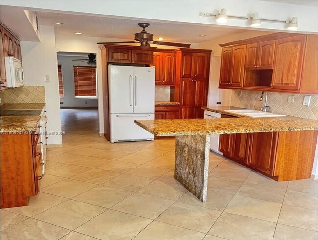 Building Photo - 3111 Coral Springs Dr Unit 215