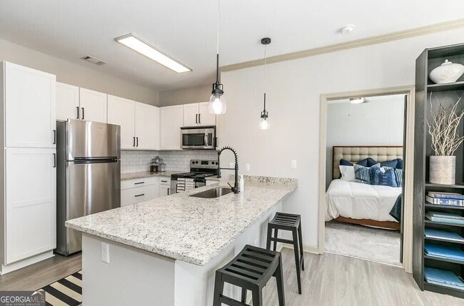 Building Photo - 1000 Ashwood Pkwy Unit 1415