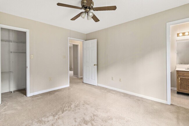 Master bedroom with ceiling fan and on suite bathroom - 1805 Colt Dr