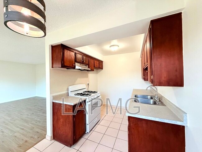 Photo - 7039-7039 Miles Ave