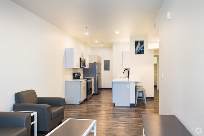 3BR, 3BA - 1,295SF - Living Room/Kitchen - University Flats Phase II