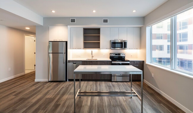 Spacious kitchens provide great natural light, quartz countertops, designer cabinetry, and more.