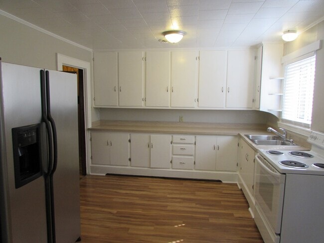 Photo - Spacious 2 Bed/1 Bath Duplex - Updated - Fireplace - Covered Side Porch - Water/Sewer/Trash Included