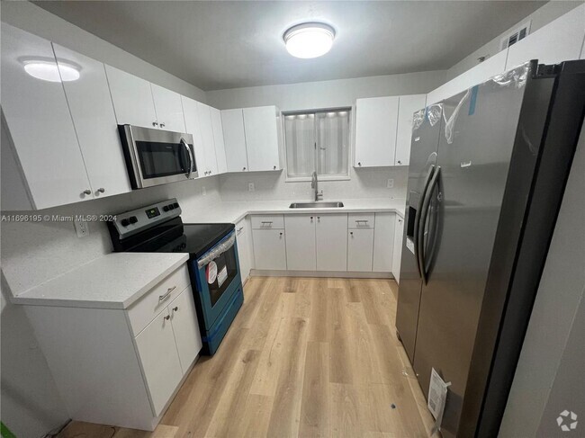 Building Photo - 7785 W 30th Ct Rental
