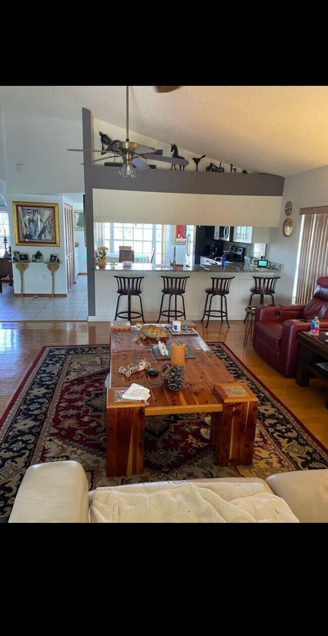 Living room view looking towards the kitchen and Island which has lowlights - 7639 Wells Ct