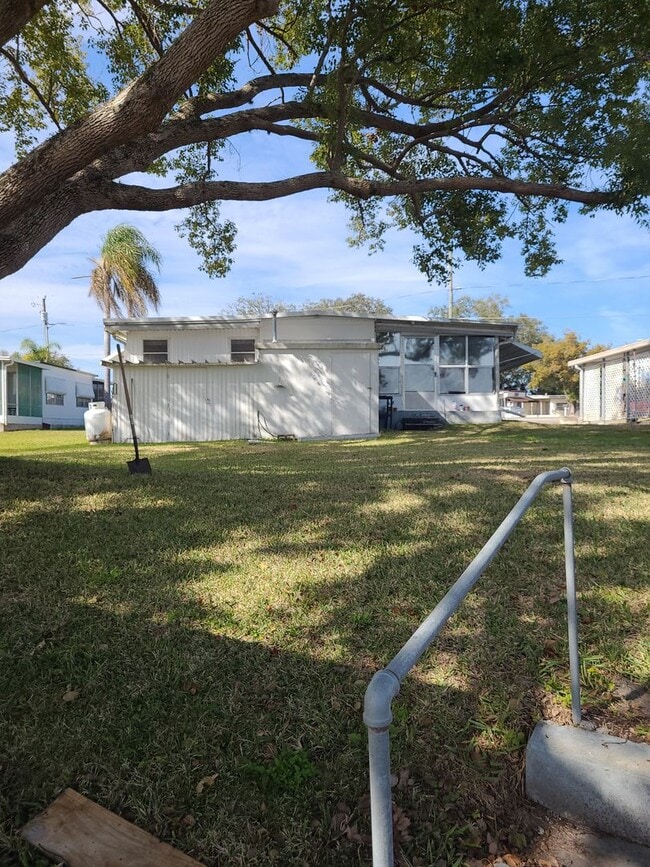 Photo - 55+ mobile home community. On canal to bea...