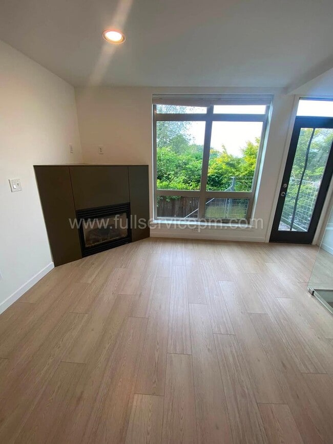 Photo - Modern Queen Anne Townhome w/ Dedicated Office, Fenced Patio, Lofted Primary Suite & Oversized Ga...