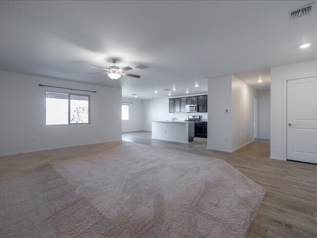 Photo - Spacious 4-Bedroom Home with Open Layout & Turf Backyard