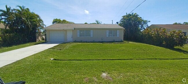 Building Photo - 2/2/1 home with a spacious fenced backyard...