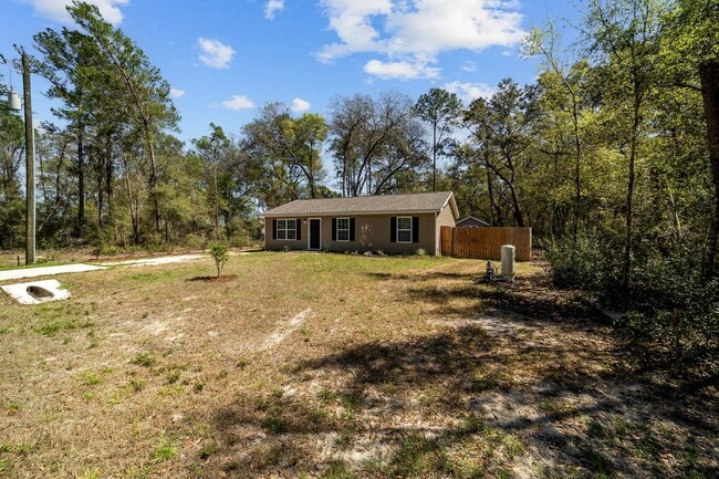 Photo - *** NOT READY FOR SHOW OR MOVE IN UNTIL AUGUST 1 *** Newer 3/2 in the country with fenced yard an...