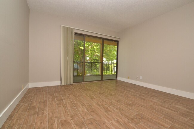 Photo - Nicely Updated 1/1 Condo in Winter Springs ~ Wood Plank Tile Floors and Large Screened Patio! Unit 4
