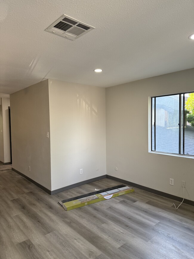 Open Living Room and Dinning Room. All new flooring, new carpets, and paint. - 1907 W Whitendale Ave Apartments Unit 1907 W. Whitendale
