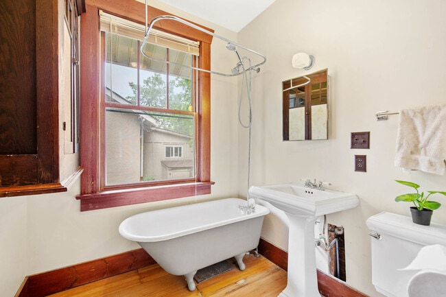 Bathroom with clawfoot tub + shower - 306 S 8th Ave Unit A