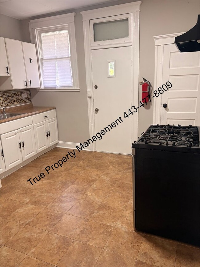 Photo - Spacious 3BR Home with Washer & Dryer, Backyard & Basement – $1,500/Month