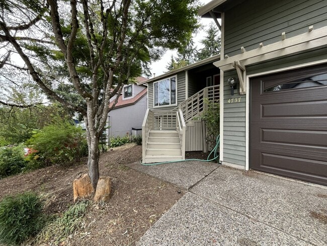 Photo - Spacious 3-Bedroom Home with Custom Stone Fireplace, Attached 2-Car Garage & Expansive Backyard i...