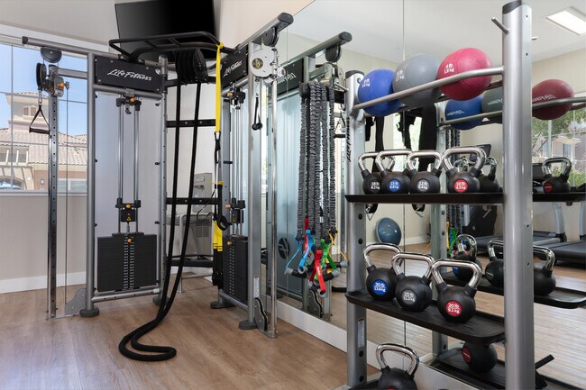 State-of-the-art fitness center with cardio equipment, strength equipment, and free weights