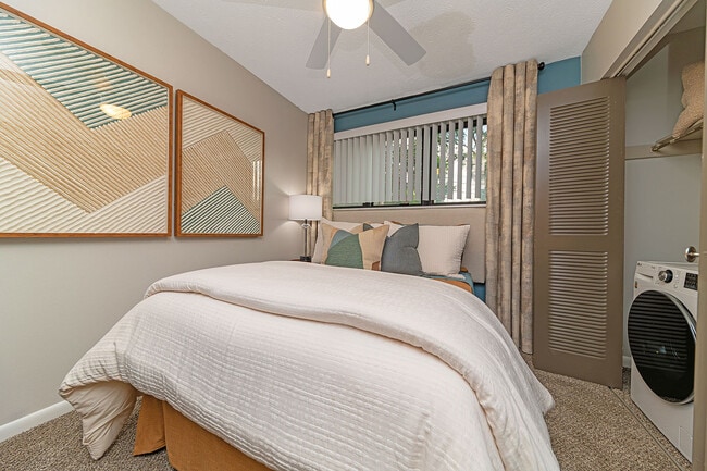 Cozy bedroom with carpet and ceiling fan