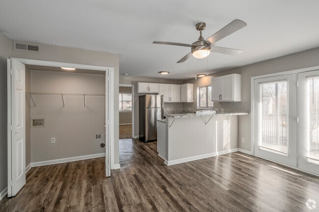 Platinum - 1BR, 1BA - 651SF - Living Room, Kitchen & Laundry - Colonial Village