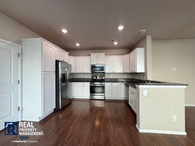 Photo - Spacious 4-Bedroom Home with Fenced Yard & 2-Car Garage Near JBLM!