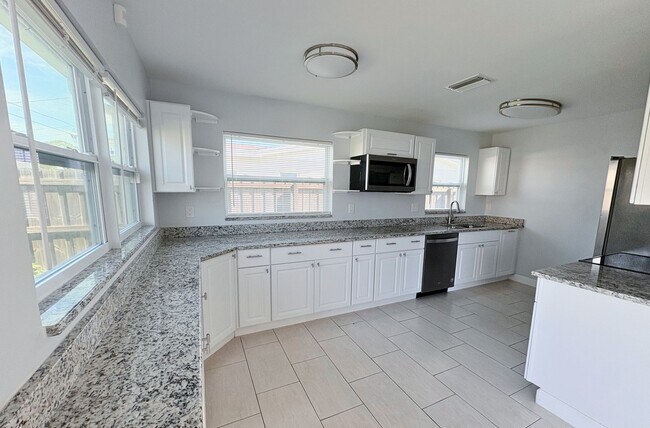 Photo - 3-Bed, 2-Bath Home with Spacious Fenced Ya...