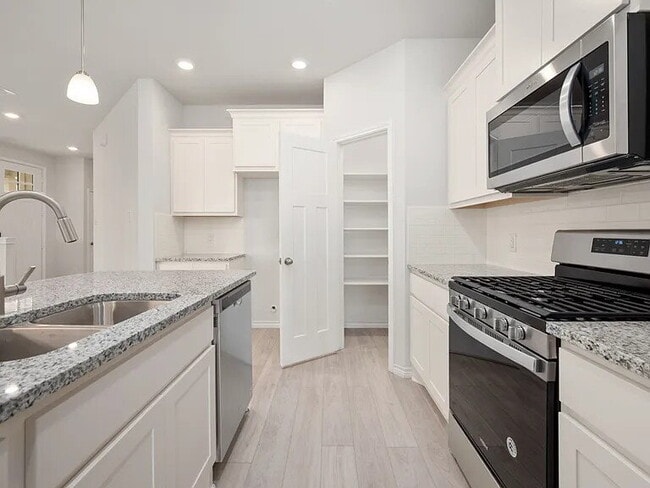 Photo - 3 Bedroom 2 bath, 2 garage attached garage with all the appliances to include washer & dryer