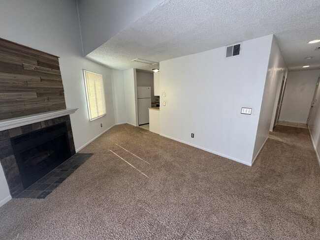 Photo - Gorgeous, 1 bedroom apartment with in-unit laundry, a fireplace, river and walking path. Unit 4