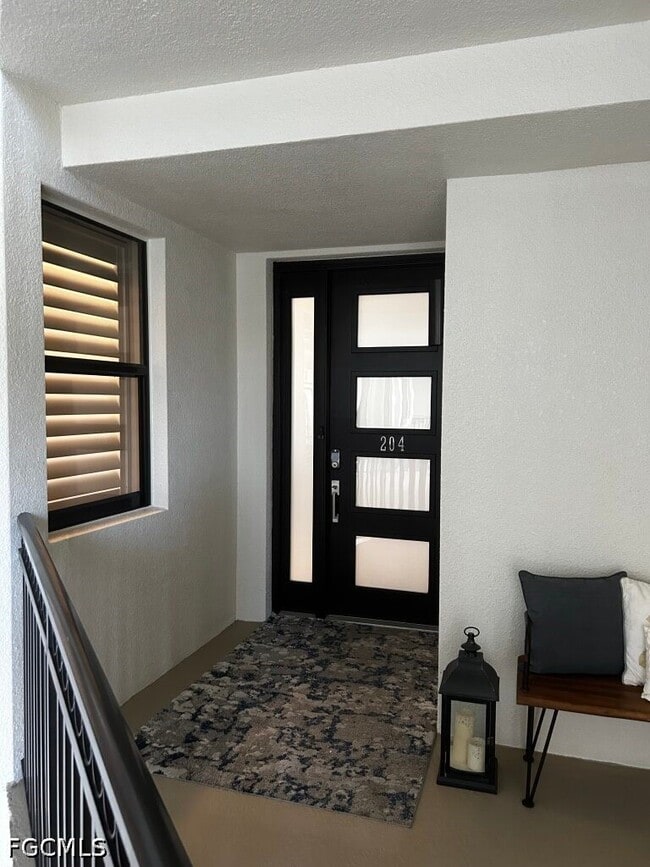 Building Photo - 11640 Court of Palms Unit 204