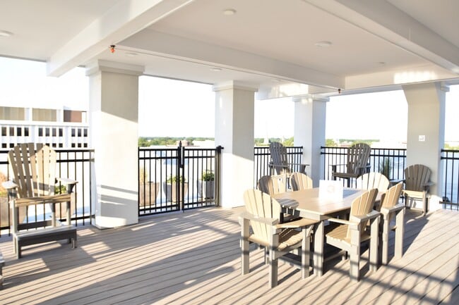 Outdoor rooftop dinning area with a beautiful view of the City