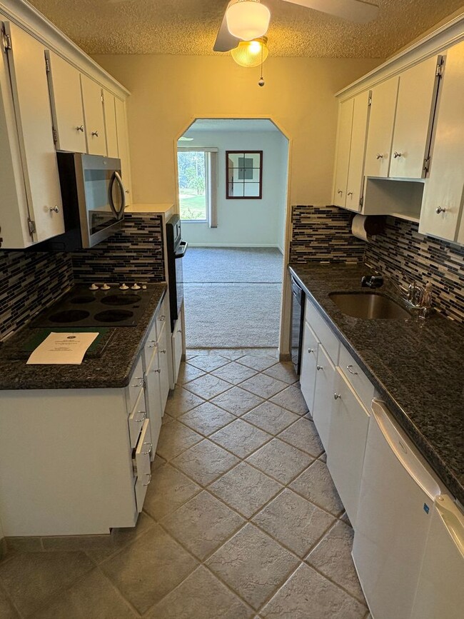 Building Photo - (55+) 2/2 Condo in the Peaceful Miles Gran...
