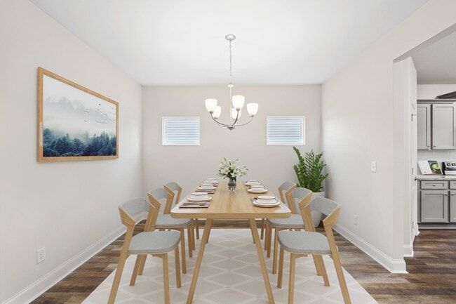Elegant dining room featuring a rich wooden table and timeless seatingdesigned for unforgettable family gatherings. - Southwind