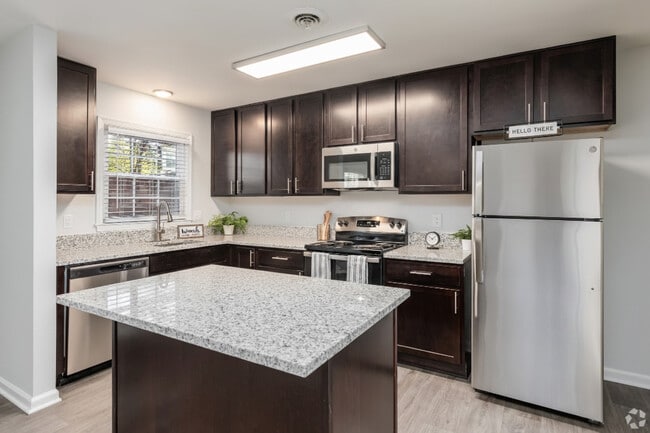 Modern Kitchens with Espresso Cabinetry, Stainless Steel Appliances, & Granite Countertops