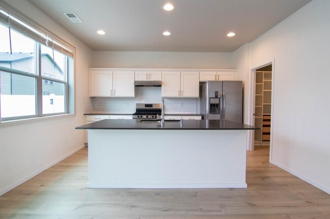 Photo - ***Coming Soon June 1st, 2026***Modern 4 bed 2.5 bath near the Fairways Golf Course, Amazon and F...