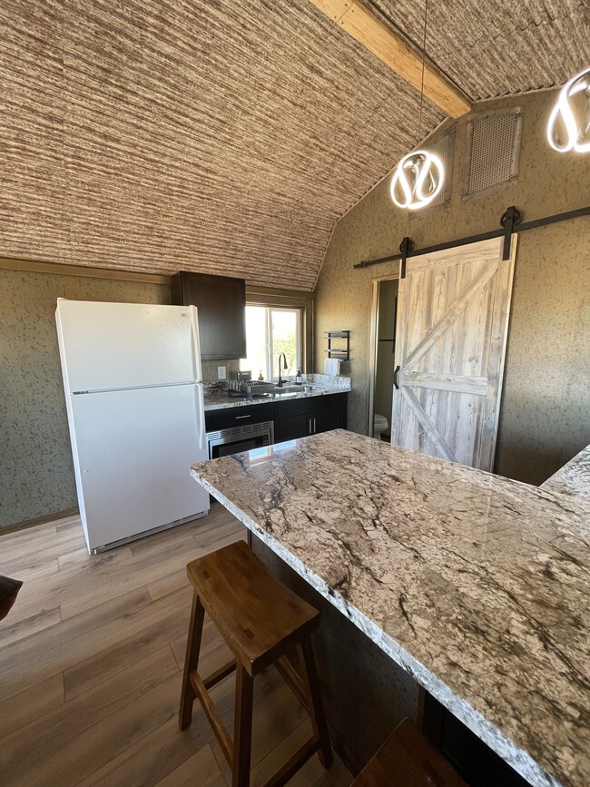 Kitchen with full size fridge. - 8405 N Via Socorro Unit C