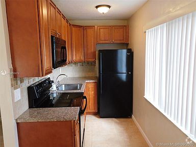 Building Photo - 5972 NW 19th St Unit 3 Rental