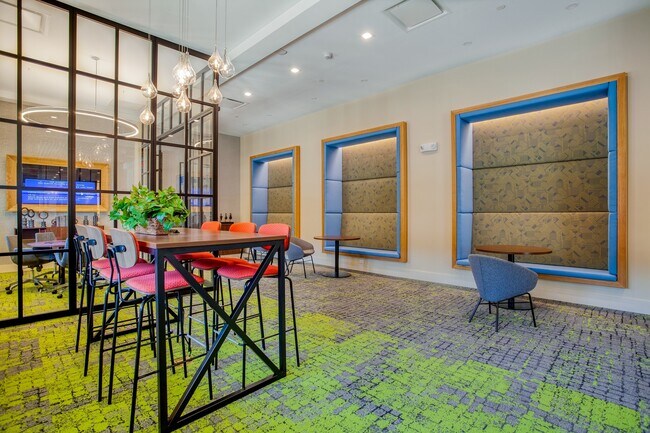 The coworking space features numerous seating areas with outlets built into the chairs and the floor for your convenience