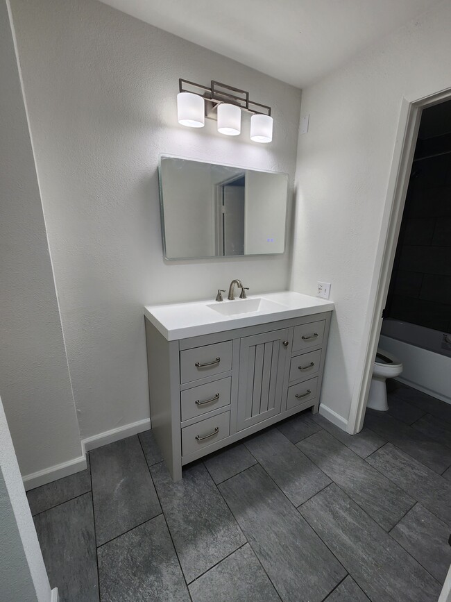 New vanity and light up mirror - 8675 Falmouth Ave Condominio Unidad 222