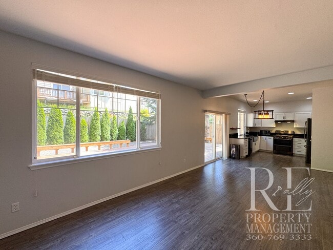 Photo - Dual Primary Suites, Huge Backyard Deck & Sun-Filled Living Spaces Near Everyday Conveniences