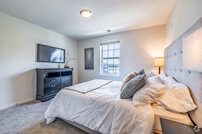 2BR, 1BA - 825SF - Primary Bedroom - Fieldchase Senior Apartments