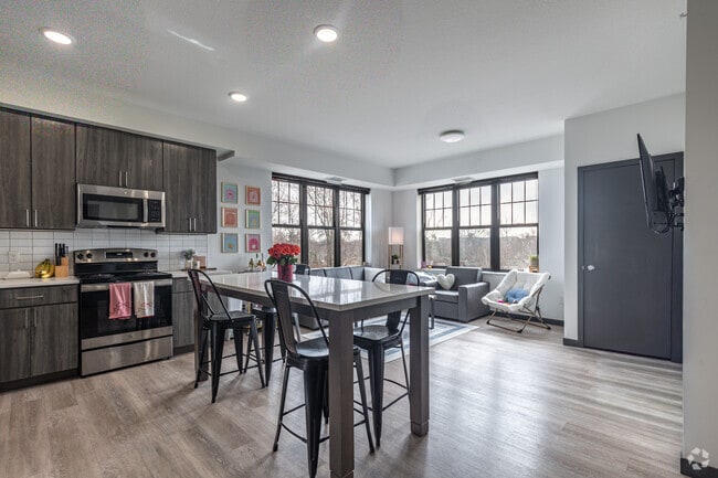 4BR, 2BA - 1,206SF - Kitchen and Living Room - Marshall at Finn