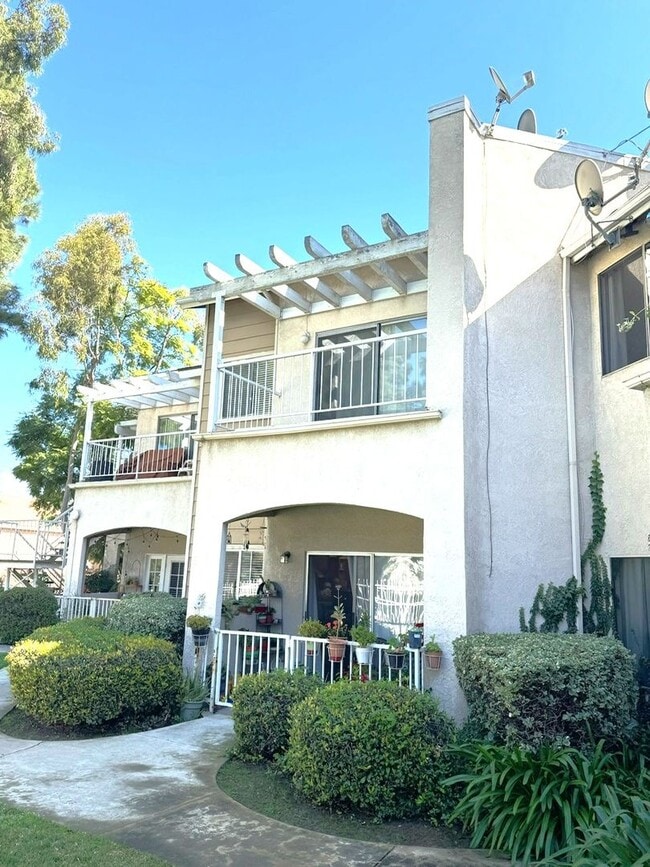 Building Photo - 2 Bedroom, 2 Bath Upstairs Condo with Private Balcony & 2-Car Garage, Gated Community, Water/Tras... Unit 3