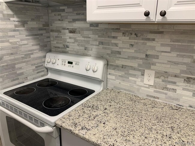 Building Photo - 7625 Quincy E Ave Unit 101