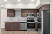 Cook in style with stainless steel appliances and modern finishes.