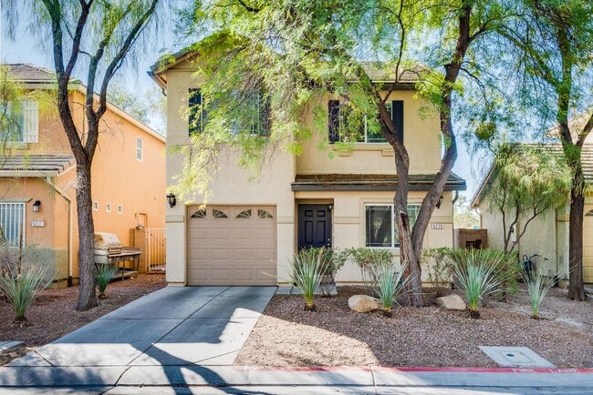 Building Photo - Very nice kept two-story 3 bedroom 2 bath house in a small gated community on the east side