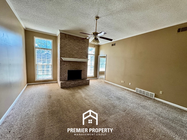 Photo - Spacious 3BR/2BA Near Southwind | 1,958 Sq Ft, Brick Fireplace, 2-Car Garage & Quiet Cove