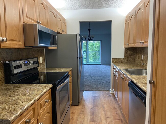 Building Photo - 13000 SW 15th Ct Unit 404U Rental